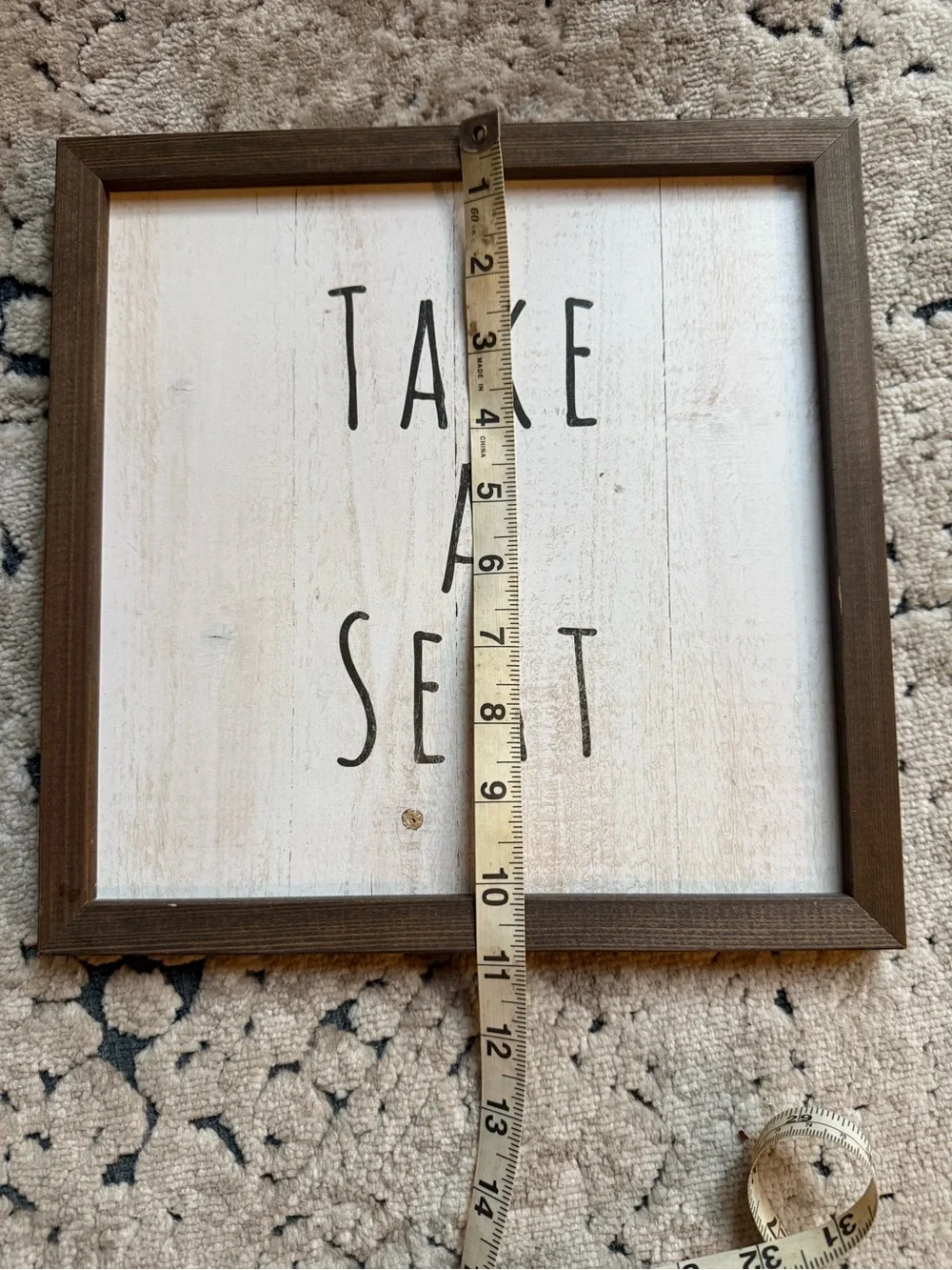 Take A Seat Framed Wall Sign - Brown Frame, White Face